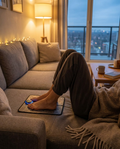 Person relaxing with feet on the EMS foot massage pad